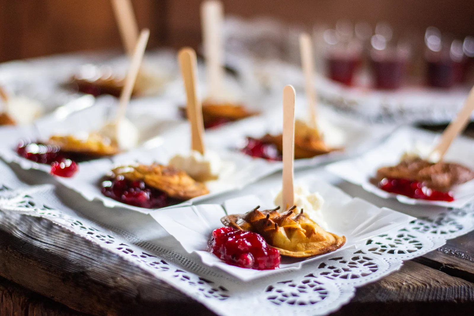Grilled cheese on sticks with cranberry jam on paper trays