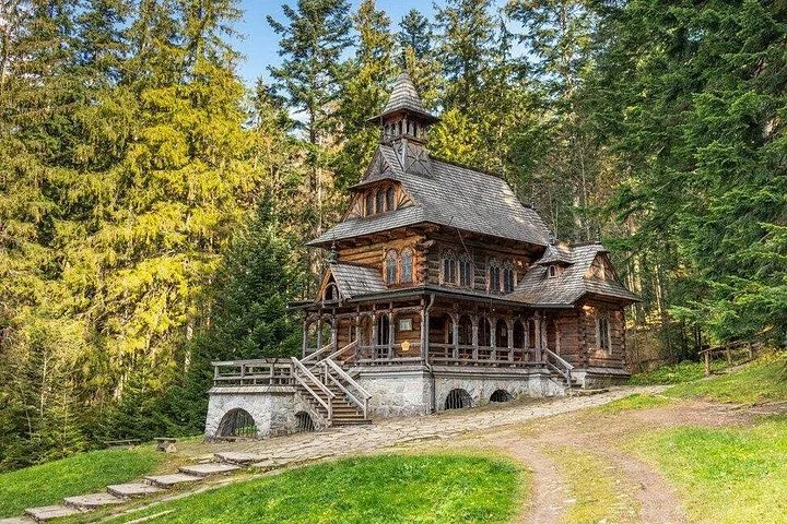 Wooden Jaszczurówka Chapel on a stone base in the forest
